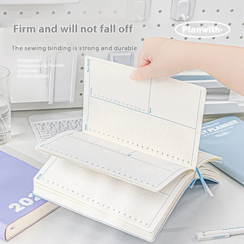 Waterproof exam notebook in mint green PU cover open to show 196 pages of writing paper.