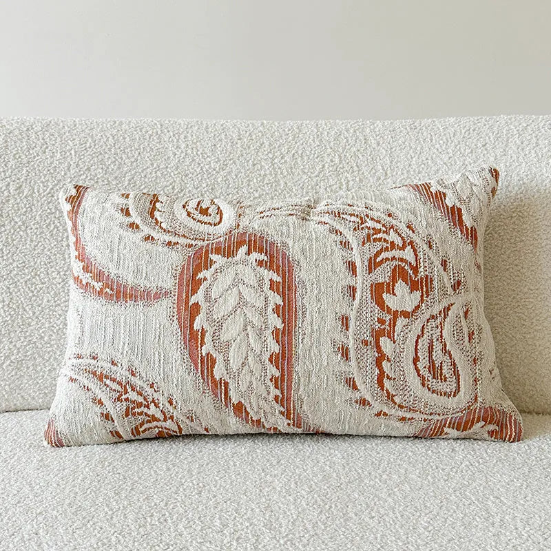 American-style jacquard cushion cover with a paisley and floral pattern in an amber colour.