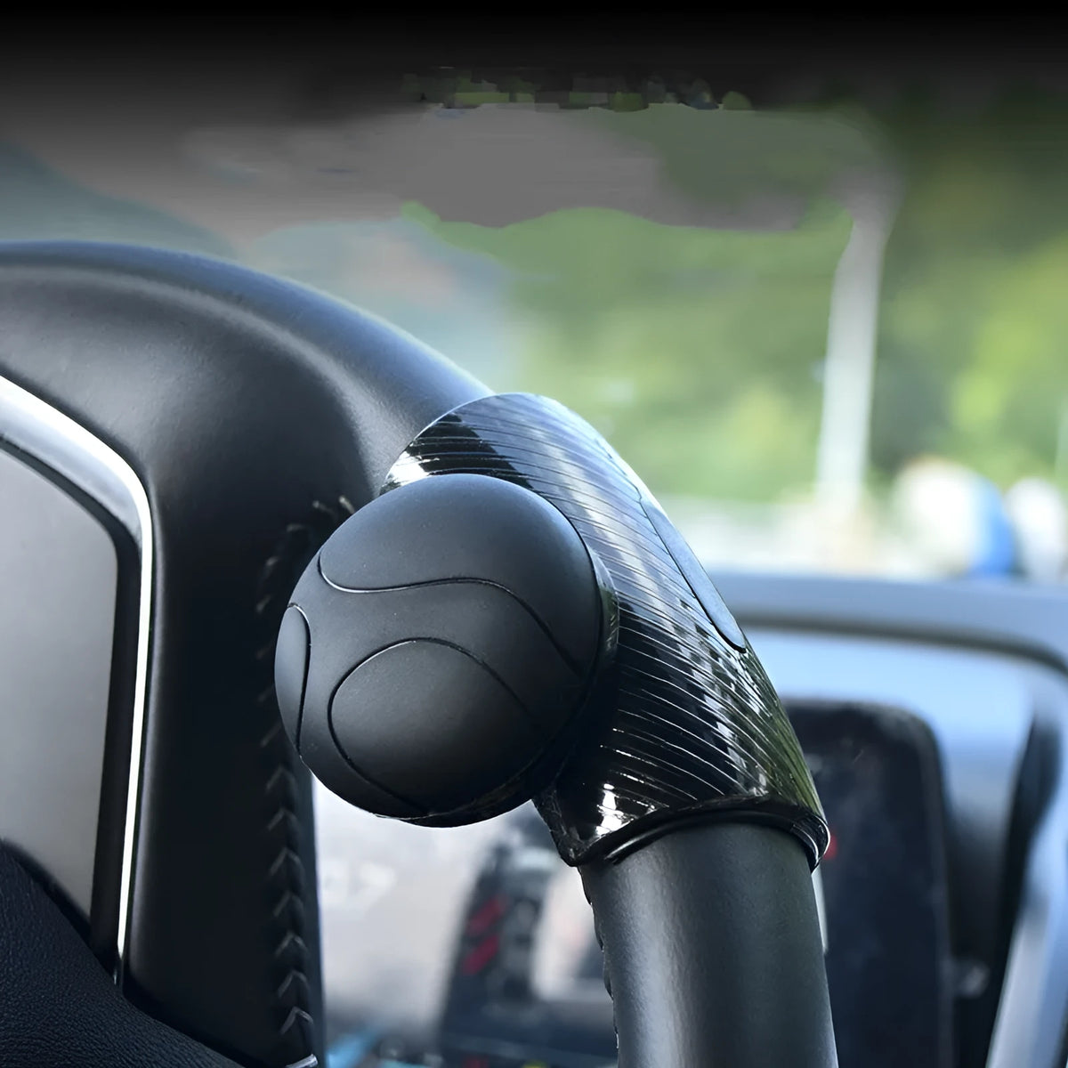 Steering wheel assist ball with silicone grip and metal bearing for single hand steering assistance