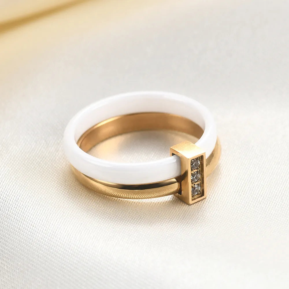 Geometric ceramic women's ring with glossy stitching and zirconium inlays in steel black finish