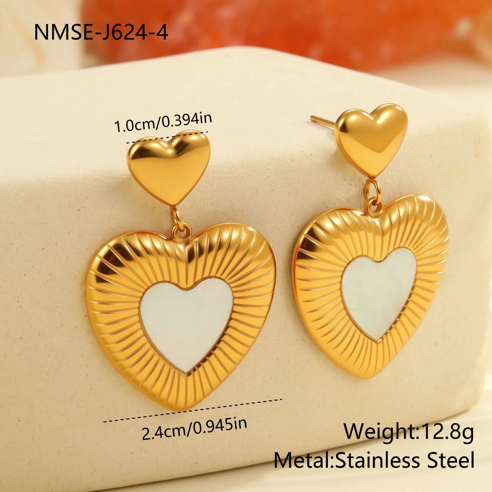 Stainless steel heart-shaped earrings with white fritillary design and 18K gold electroplating finish