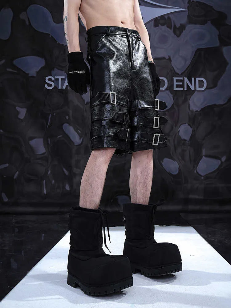 Men's black PU leather cropped pants showing mid to low waist design and flexible polycarbaminate construction