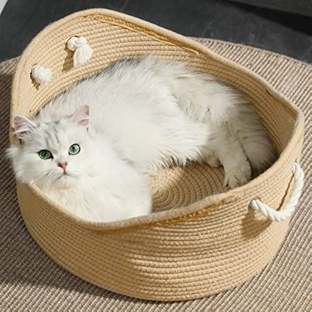 Woven wicker cat bed basket with corrugated scratching board interior for feline resting and claw maintenance