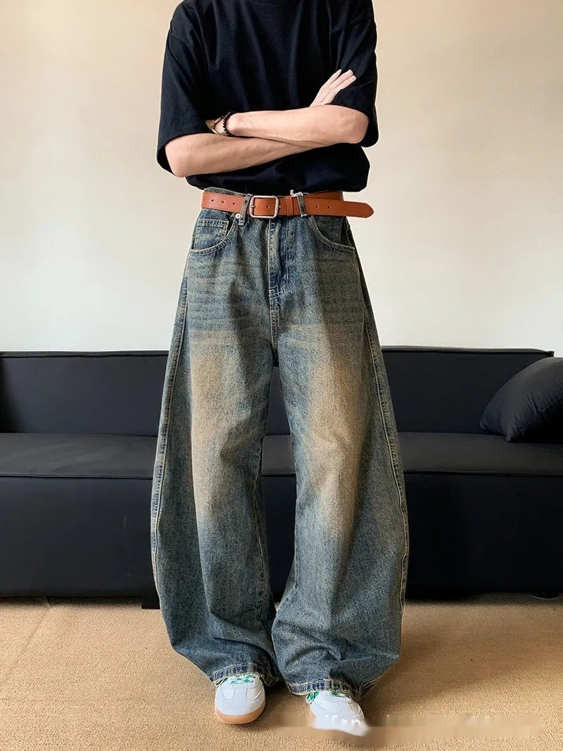 Men's retro blue distressed denim jeans with wide-leg trouser design and micro-elastic fabric