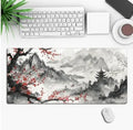 Anime design gaming mouse pad with non-slip rubber base shown on a desk