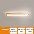 A sleek, linear black strip ceiling lamp with a PVC shade mounted on a white ceiling.