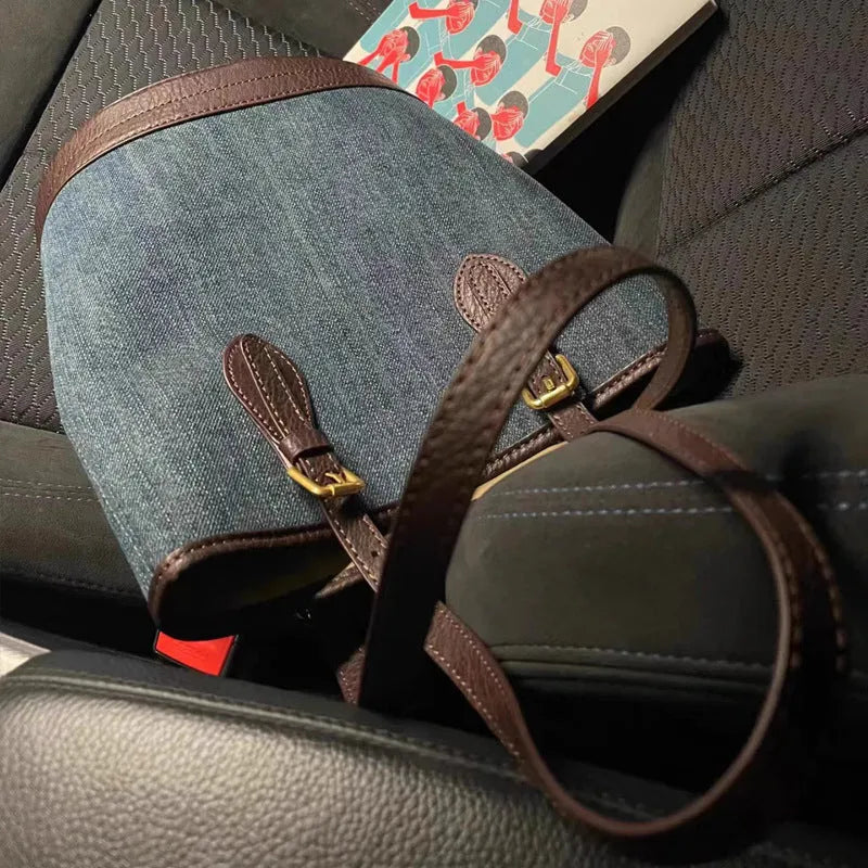 Retro denim patchwork one-shoulder bucket handbag showing large capacity interior