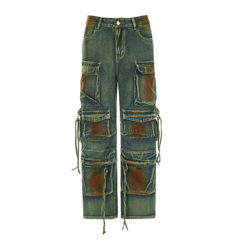 Loose blue denim cargo trousers with multiple gradient colour pockets and decorative stitching.