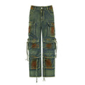Loose blue denim cargo trousers with multiple gradient colour pockets and decorative stitching.
