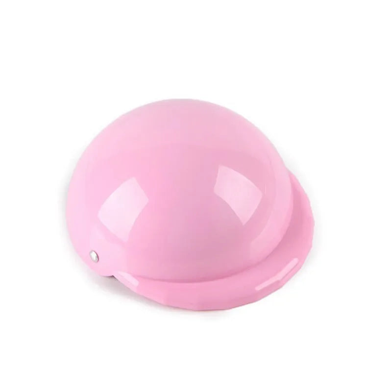Plastic dog motorcycle cap helmet in assorted colours on a white background