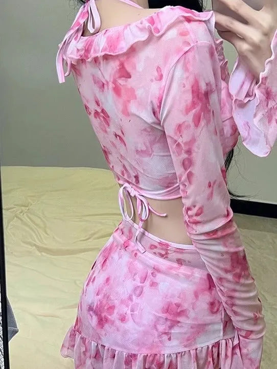 Women's cherry blossom pink floral print bikini swimsuit set on a white background.
