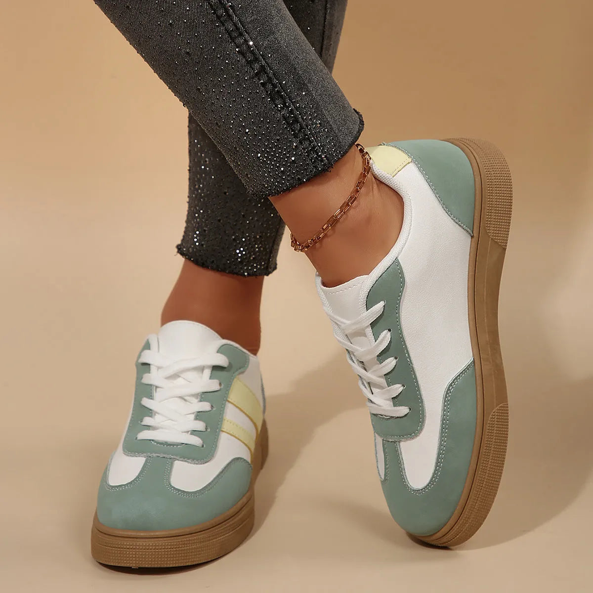 Green women's retro sports shoes with cross strap detail and round toe
