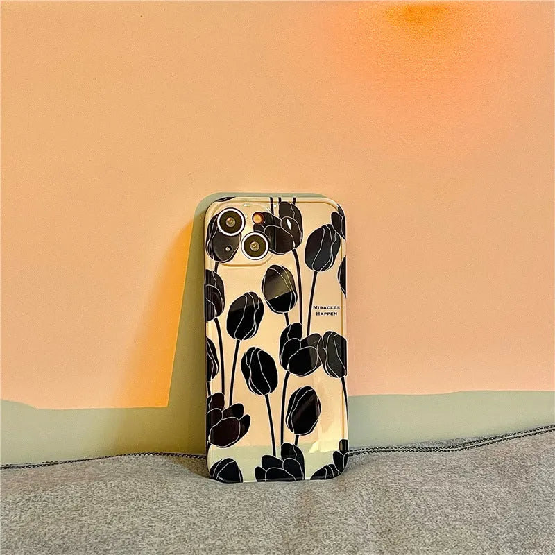 Black silicone iPhone case with tulip design for iPhone 13, 12, 11, X, and 7/8 Plus models