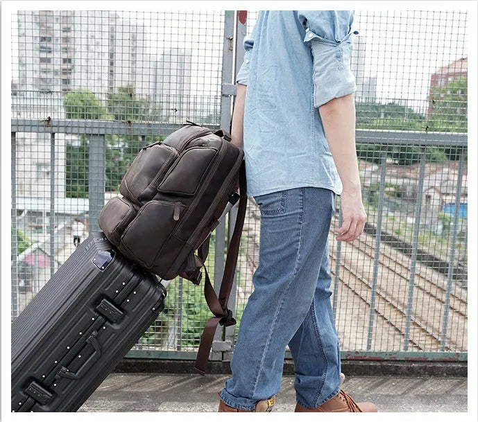 Dark brown retro crazy horse leather backpack for men with double shoulder straps, open front pocket.