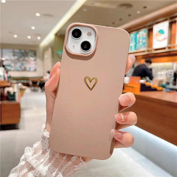 Brown silicone iPhone case with a hot stamped white love heart design on the back.