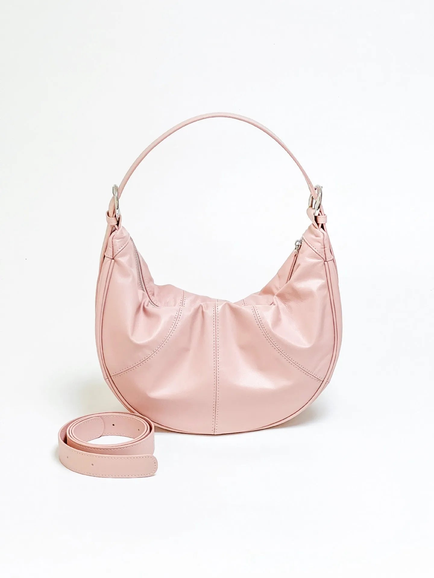 First layer cowhide shoulder bag in dumpling shape with double joint strap and sandwich pocket available in multiple colours