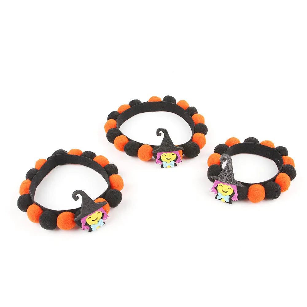 Halloween pet collar with decorative fur ball in pumpkin, bow, skull, and witch designs