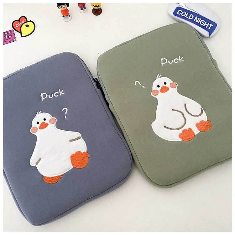 Blue cotton tablet case with embroidered duck design and zipper closure