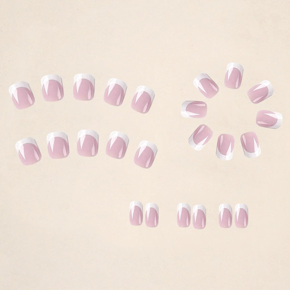 24 white square fake nails with a black and white plaid pattern design laid out on a surface.
