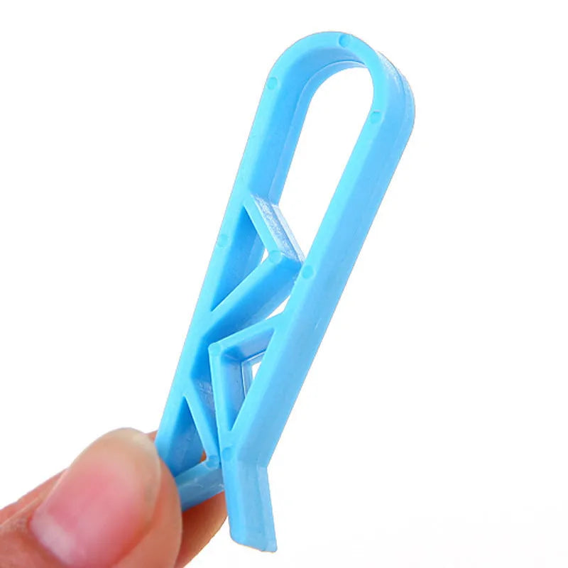 Pack of ten white plastic garbage bag fixing clips for the side of a trash can.