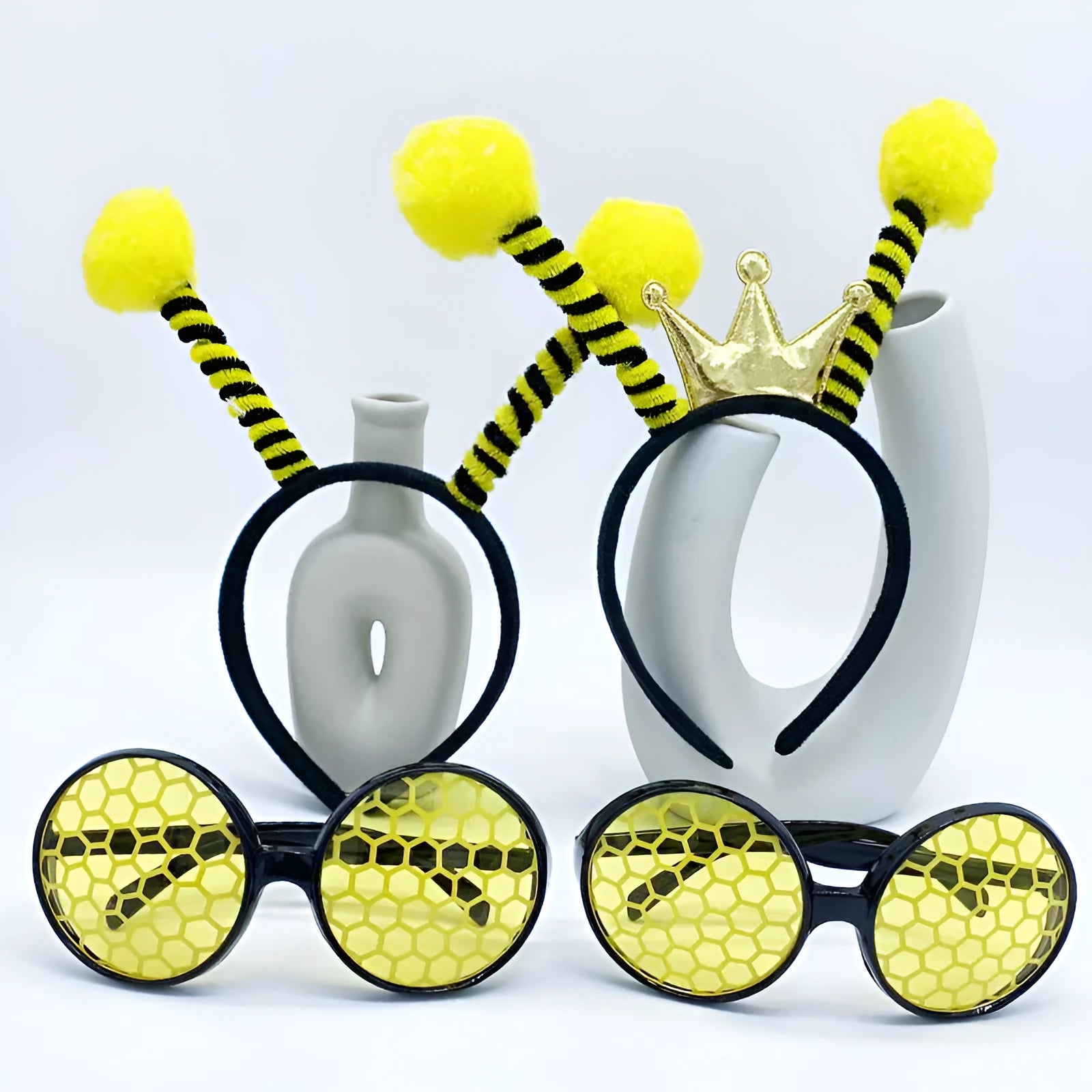 Yellow bee costume headband and matching glasses set on mannequin display