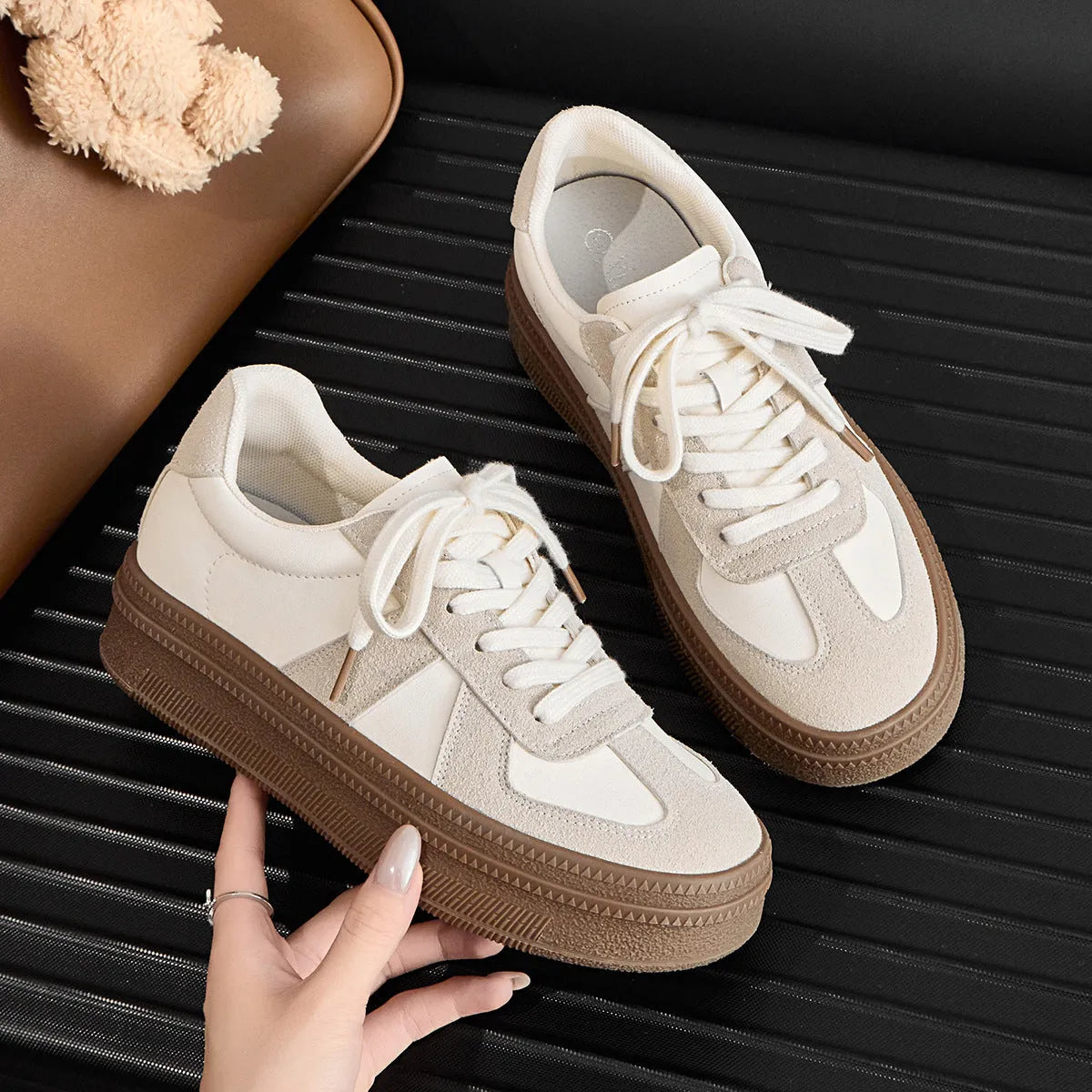 Retro milky white board shoes with cross shoulder straps and round toe on a rubber sole