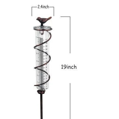 Cast iron bird rain gauge with glass measurement tube showing 0-800ml capacity