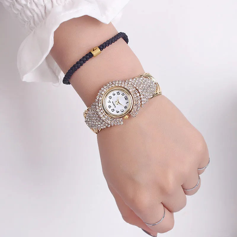 Women's 33mm quartz watch with circular dial, metal case, alloy strap, and open buckle