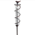 Cast iron bird rain gauge with glass measurement tube showing 0-800ml capacity