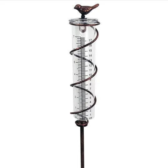 Cast iron bird rain gauge with glass measurement tube showing 0-800ml capacity