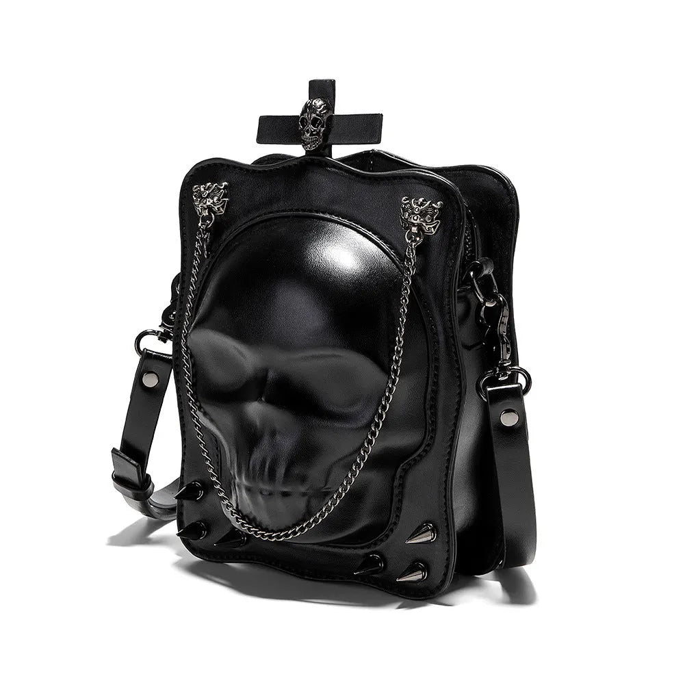 Black Halloween skull shoulder bag with embossed design, chain strap, and vertical square messenger shape