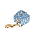 Blue triangular ring rope dog vest, collar, leash, and bow four-piece set laid out flat.