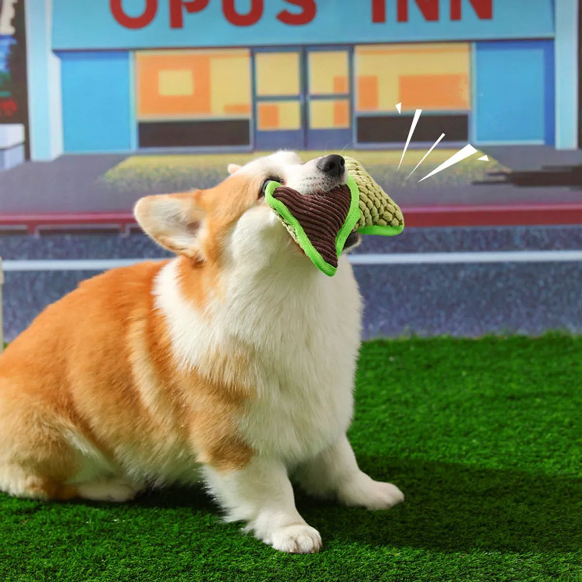 Blue dog toy with a squeaker bone, showing soft corn fleece lining and bite-resistant texture.