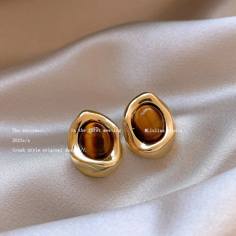 Handmade geometric tassel earrings in three electroplated styles: round piece, irregular, and water drop designs