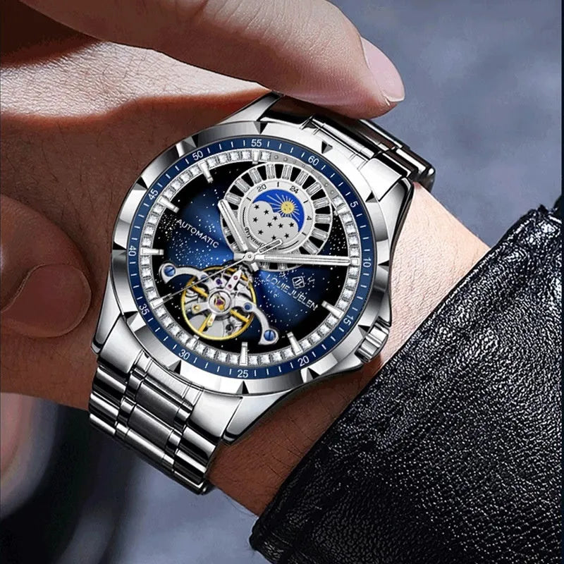 Silver alloy case automatic mechanical watch with blue dial, stainless steel strap, and transparent case back for men