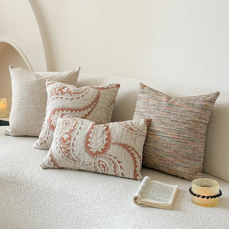 American-style jacquard cushion cover with a paisley and floral pattern in an amber colour.