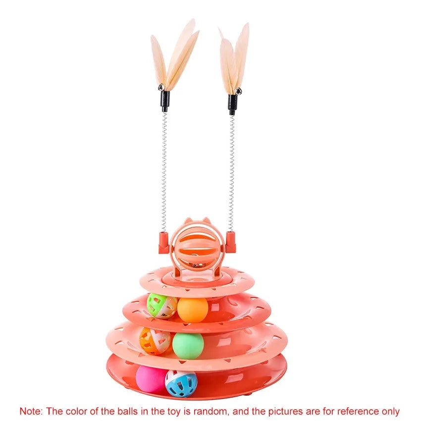 Blue four-tier interactive cat puzzle toy with rolling balls and teaser rods on a table.