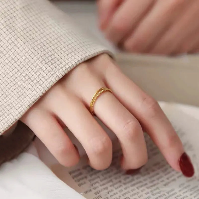 Brass gold plated women's ring showing twist, matte, and glossy style options
