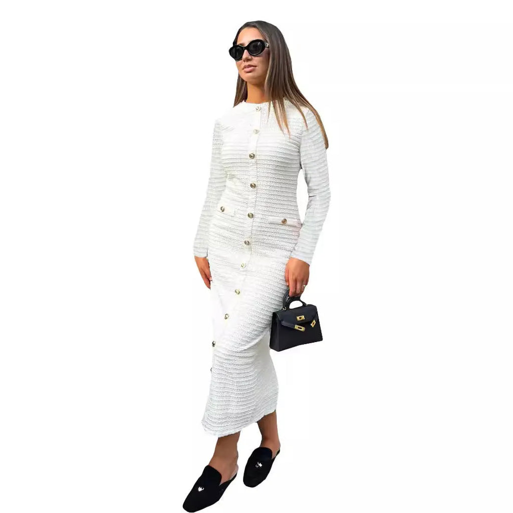 French retro slim fit knitted long-sleeved dress in black with button detail.
