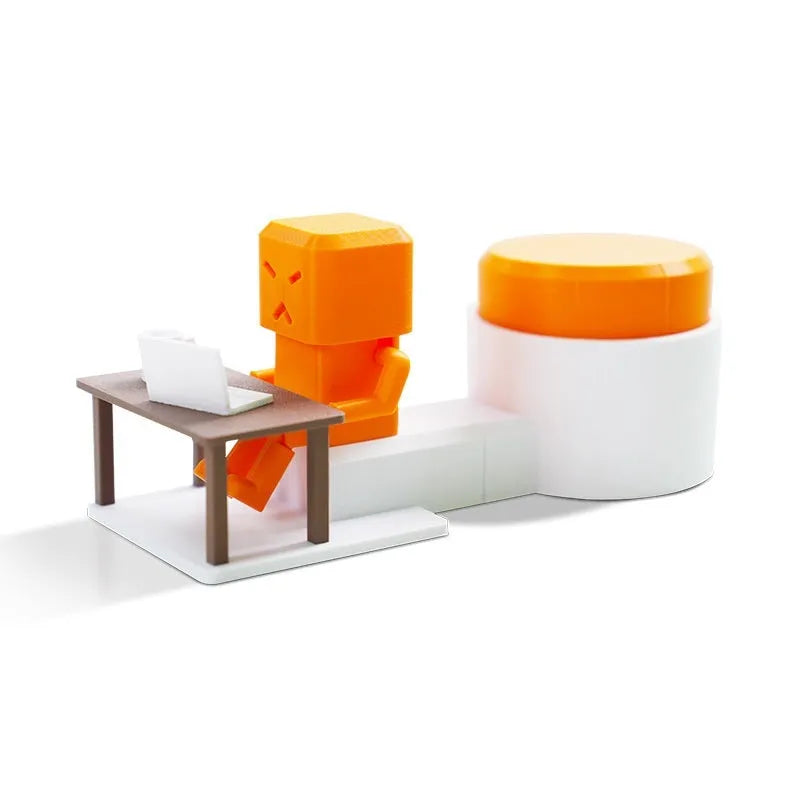 Orange plastic vent decompression toy with push buttons on a desk