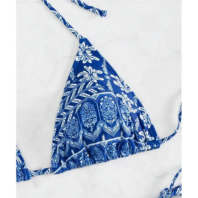 Women's green bandage style bikini with printed stitching on a briefs bottom.