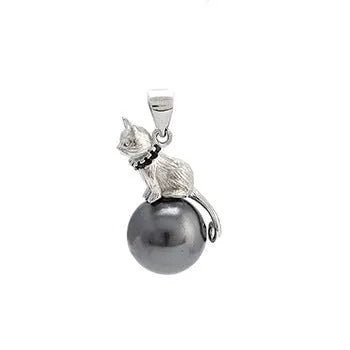 Close-up of a sterling silver cat pendant necklace on a clavicle chain.