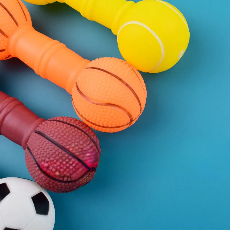 Colourful PVC squeaky dog toy shaped like a football dumbbell on a white background.