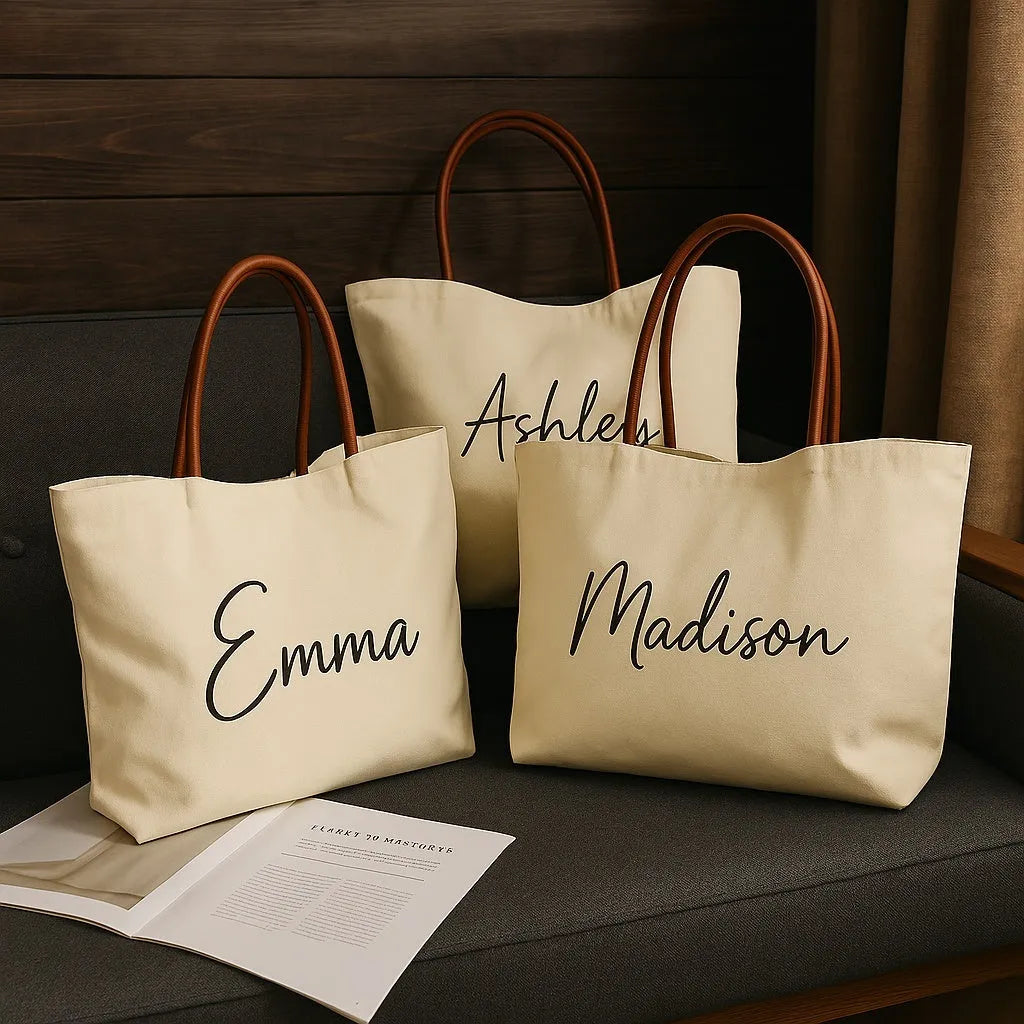 Beige white canvas tote bag with adjustable cotton handles showing reinforced bottom stitching.