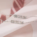 Stainless steel digital bracelet or necklace with diamond studs and clear number display.