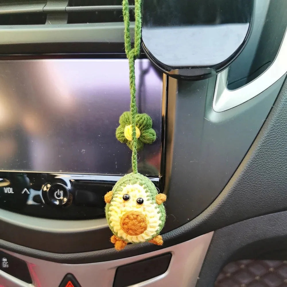 Handmade crocheted wool car pendant in avocado colour with rainbow flower design