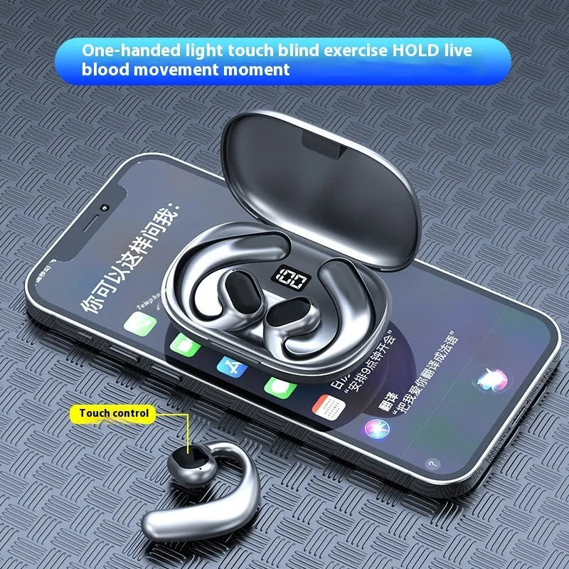 Black and white ear-mounted Bluetooth headset with digital display screen, shown with charging cable.