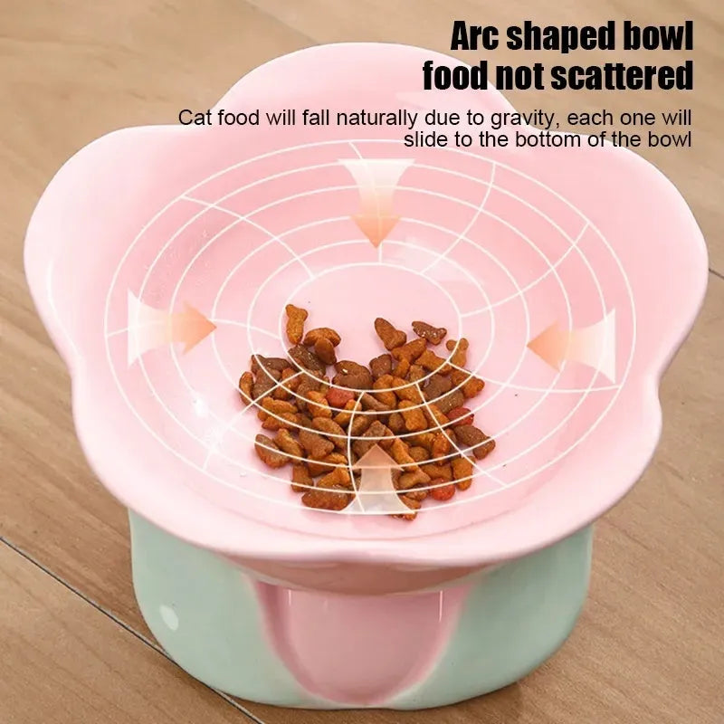 Blue ceramic elevated pet bowl with floral pattern and non-slip base for cats and small dogs.