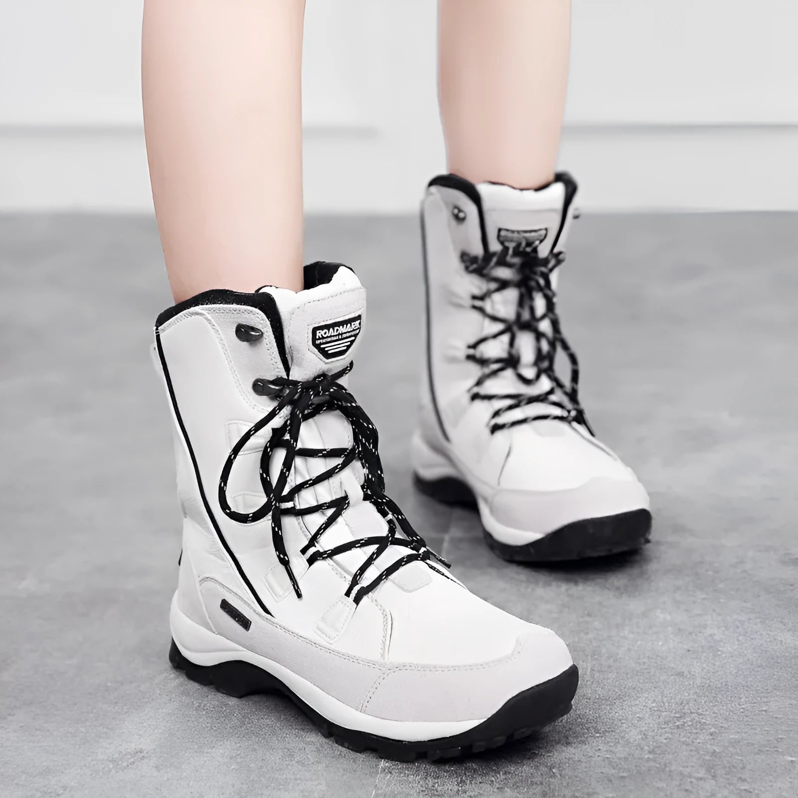 Women's black genuine leather mid-calf thermal snow boots with round toe and rubber sole