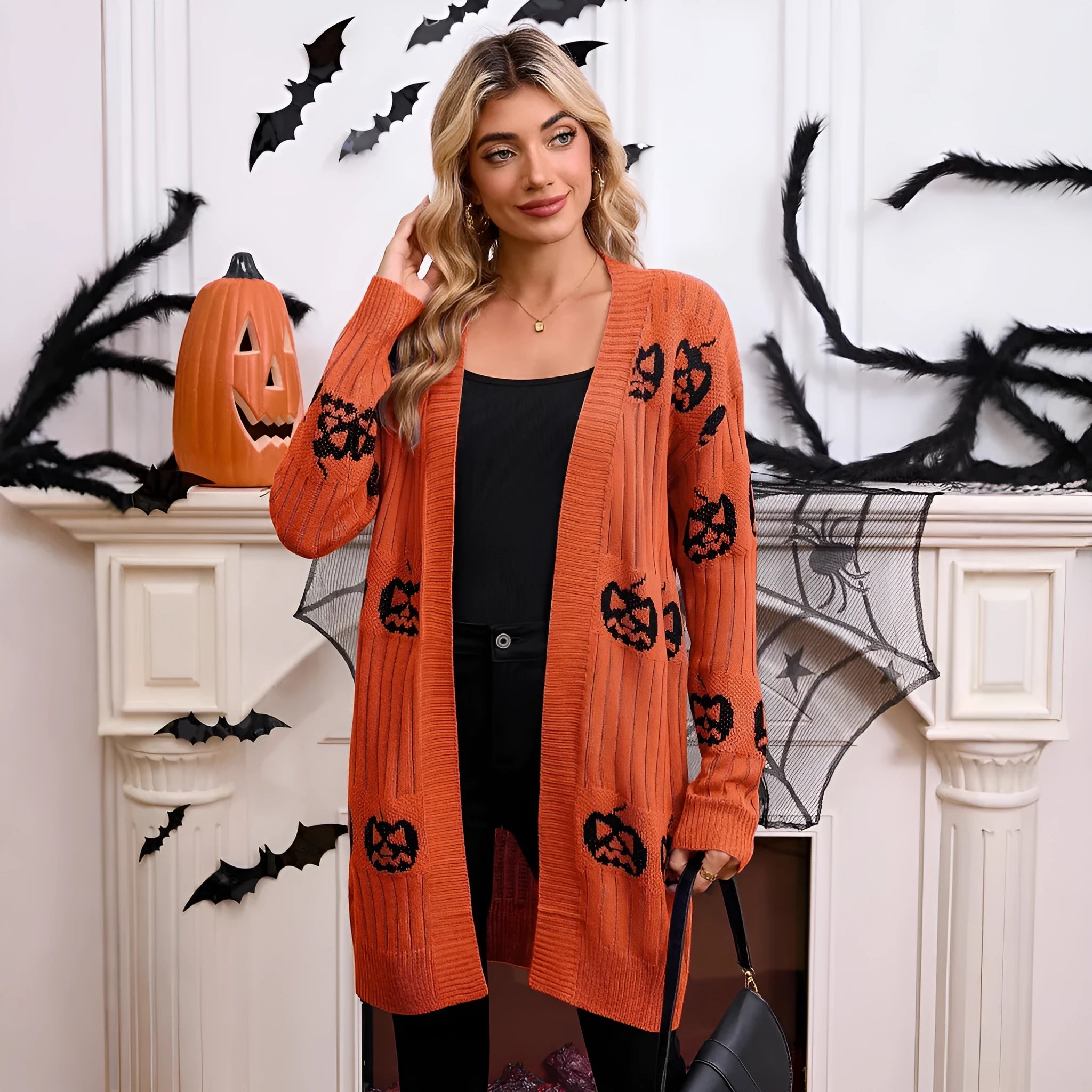 Women's black Halloween cardigan with orange pumpkin head jacquard pattern, regular sleeves, straight cut
